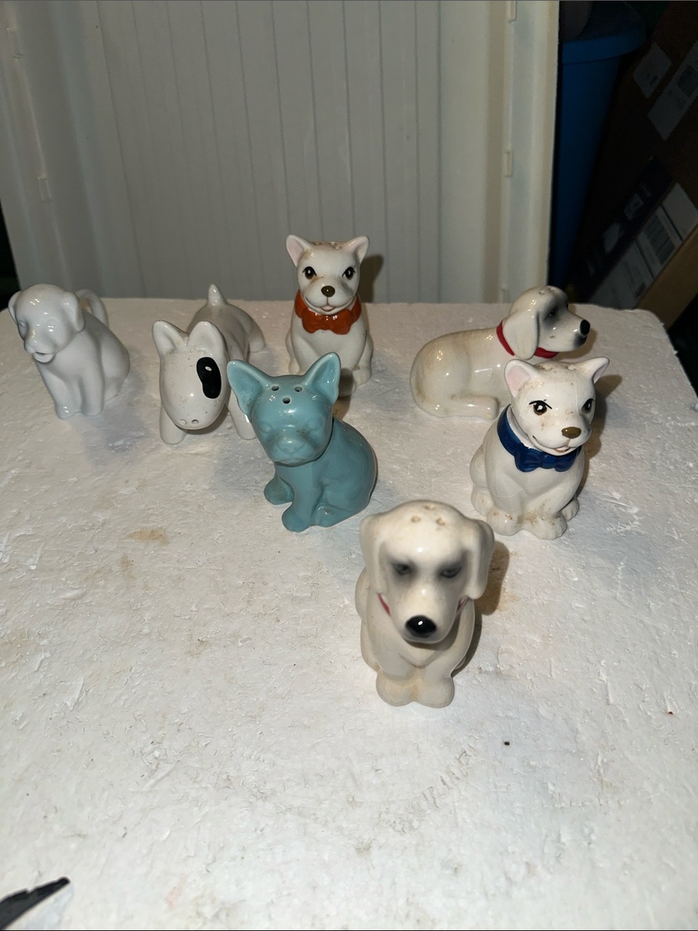 Lot of six dog salt and pepper shakers and one creamer